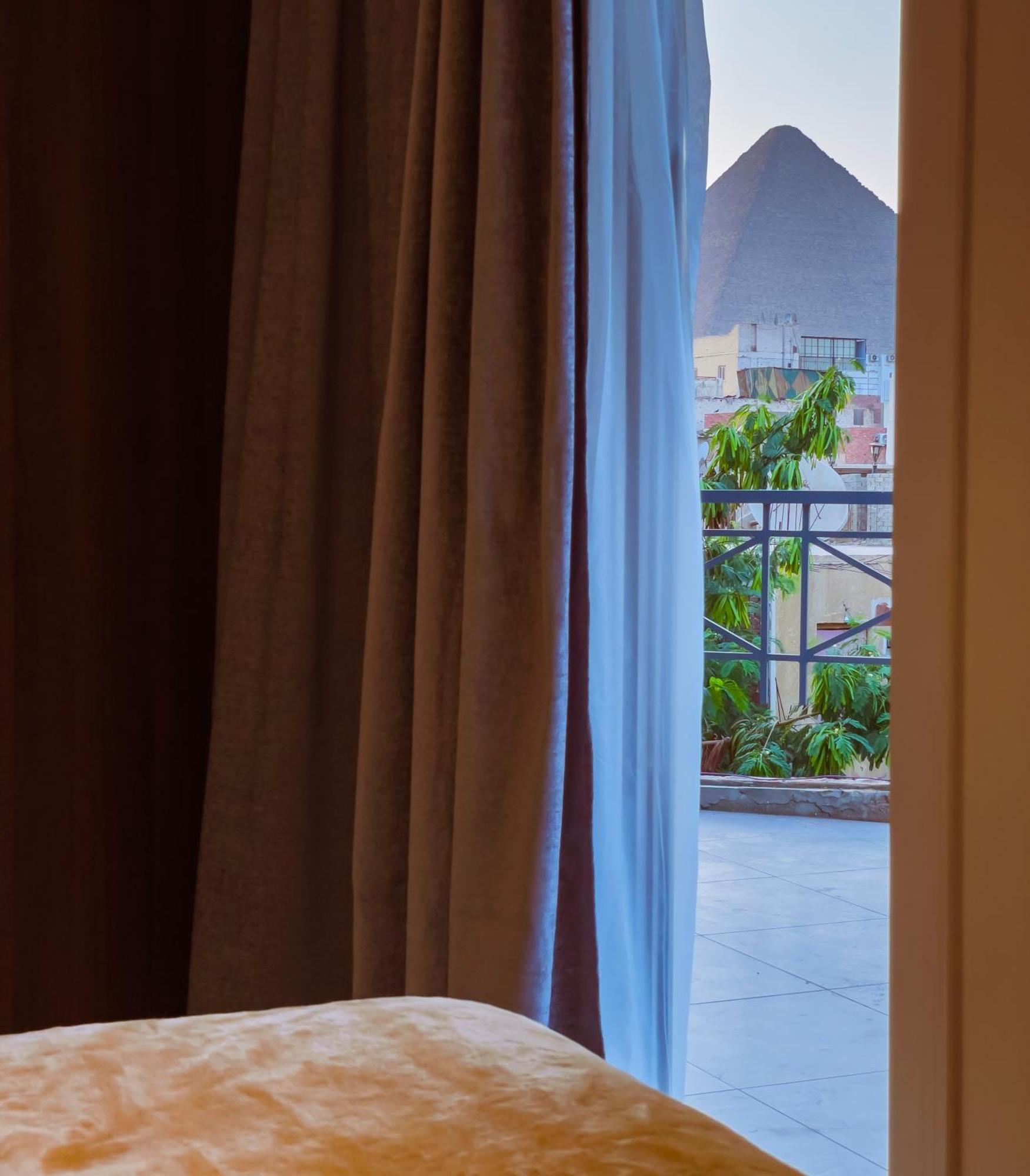 King Khufu Pyramids View Hotel Kafret el-Gabal Rom bilde